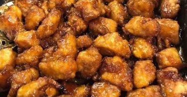 Baked Sweet and Sour Chicken: Crispy breaded chicken baked to perfection, served with a sweet and tangy sauce, perfect for a weeknight dinner or a special occasion.