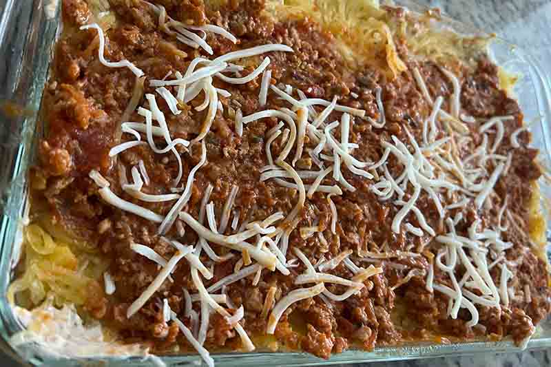 Million Dollar Spaghetti Casserole Recipe: A cheesy and delicious casserole dish made with spaghetti, ground beef, and cheese, perfect for a weeknight dinner or a potluck.