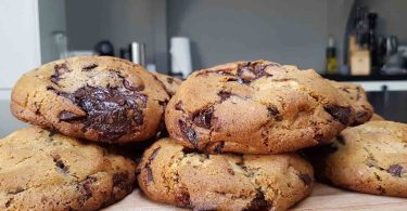 Delicious and chewy chocolate chip cookies, golden brown and loaded with chocolate chips.